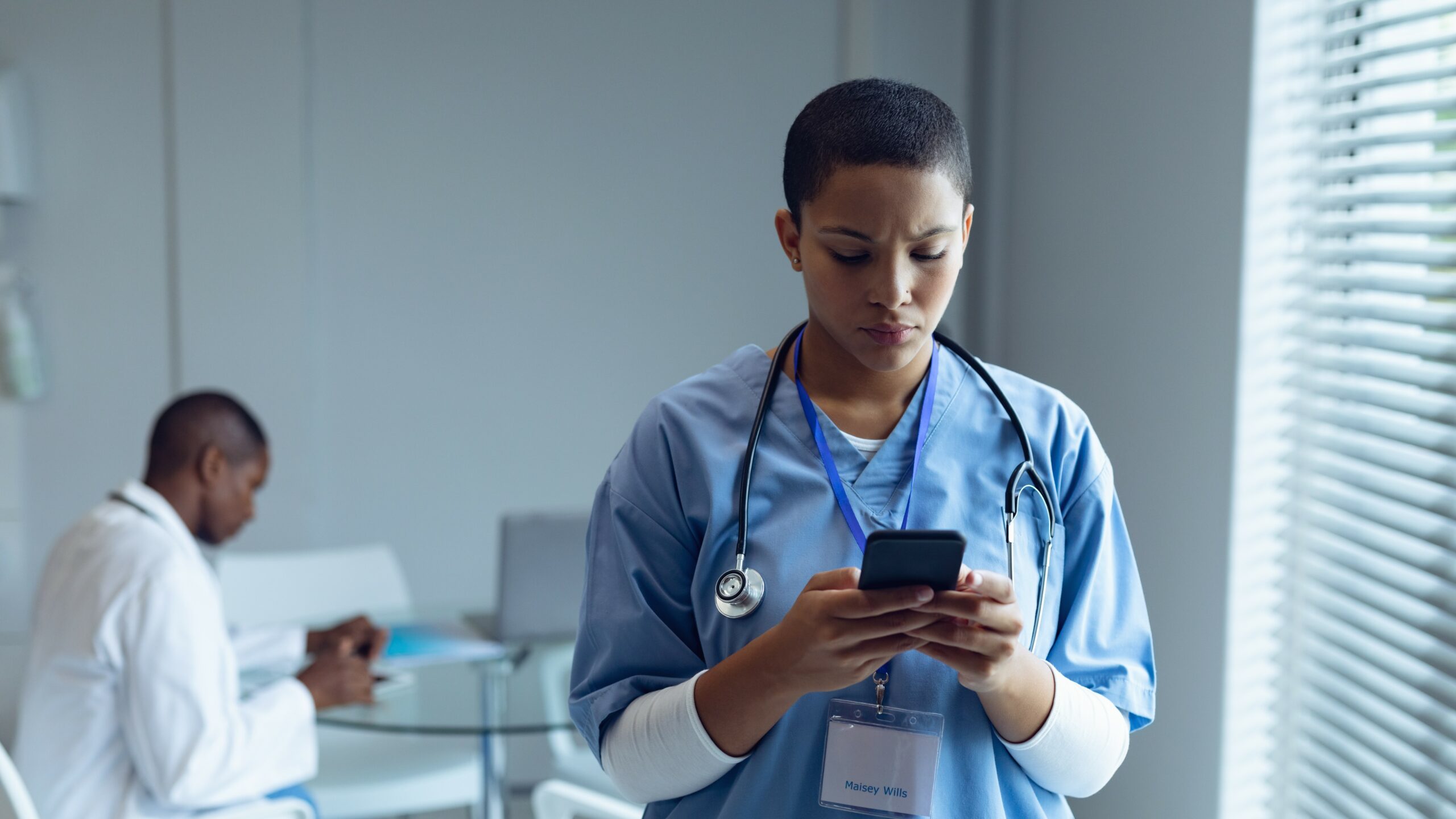 female doctor on her phone