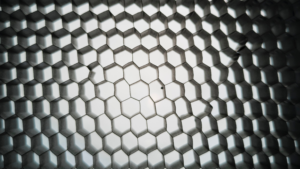 Close up of a material that creates a hexagonal grid.