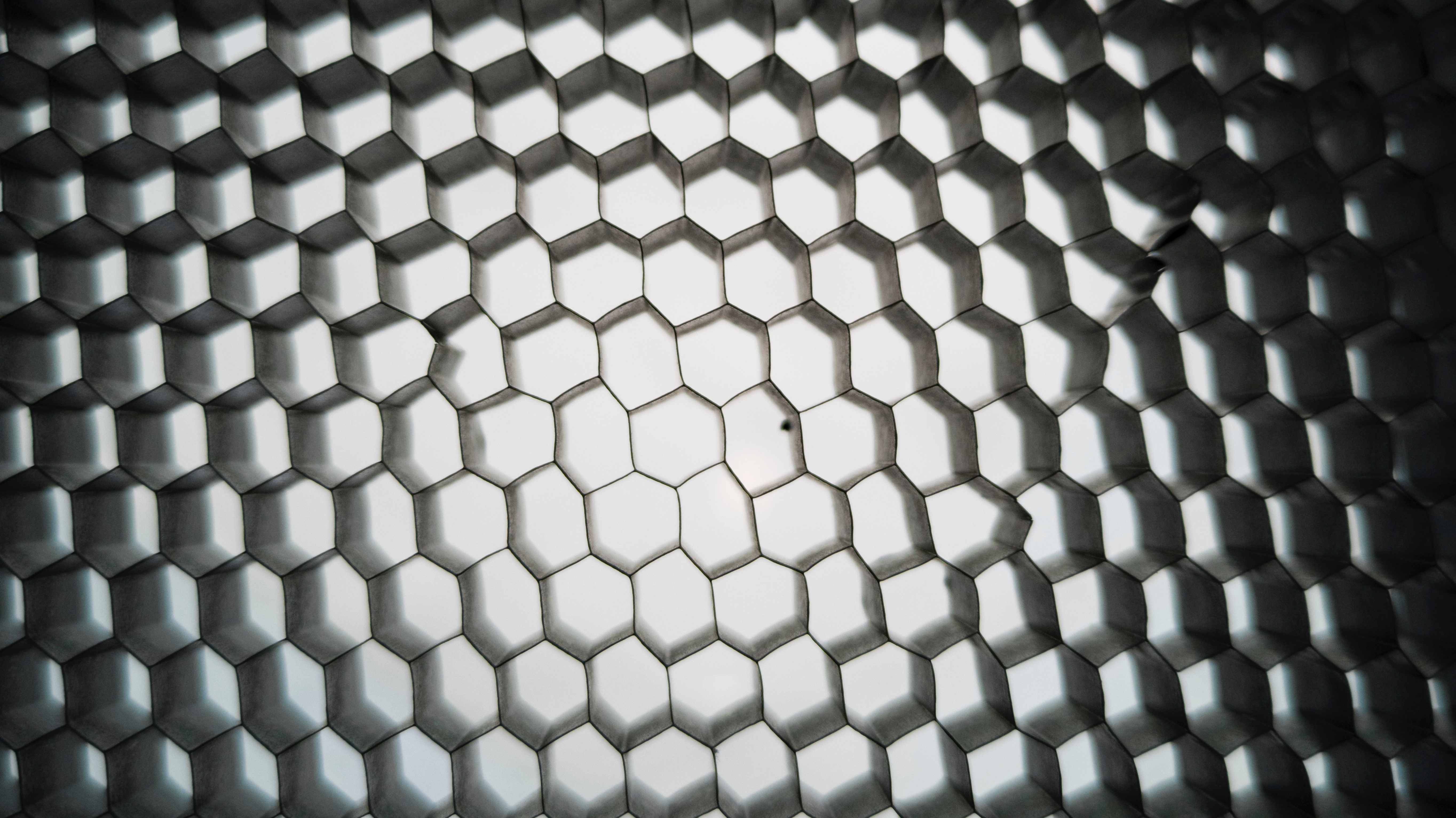 Close up of a material that creates a hexagonal grid.