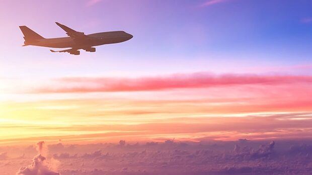 An aeroplane flying as seen from an aeroplane window.